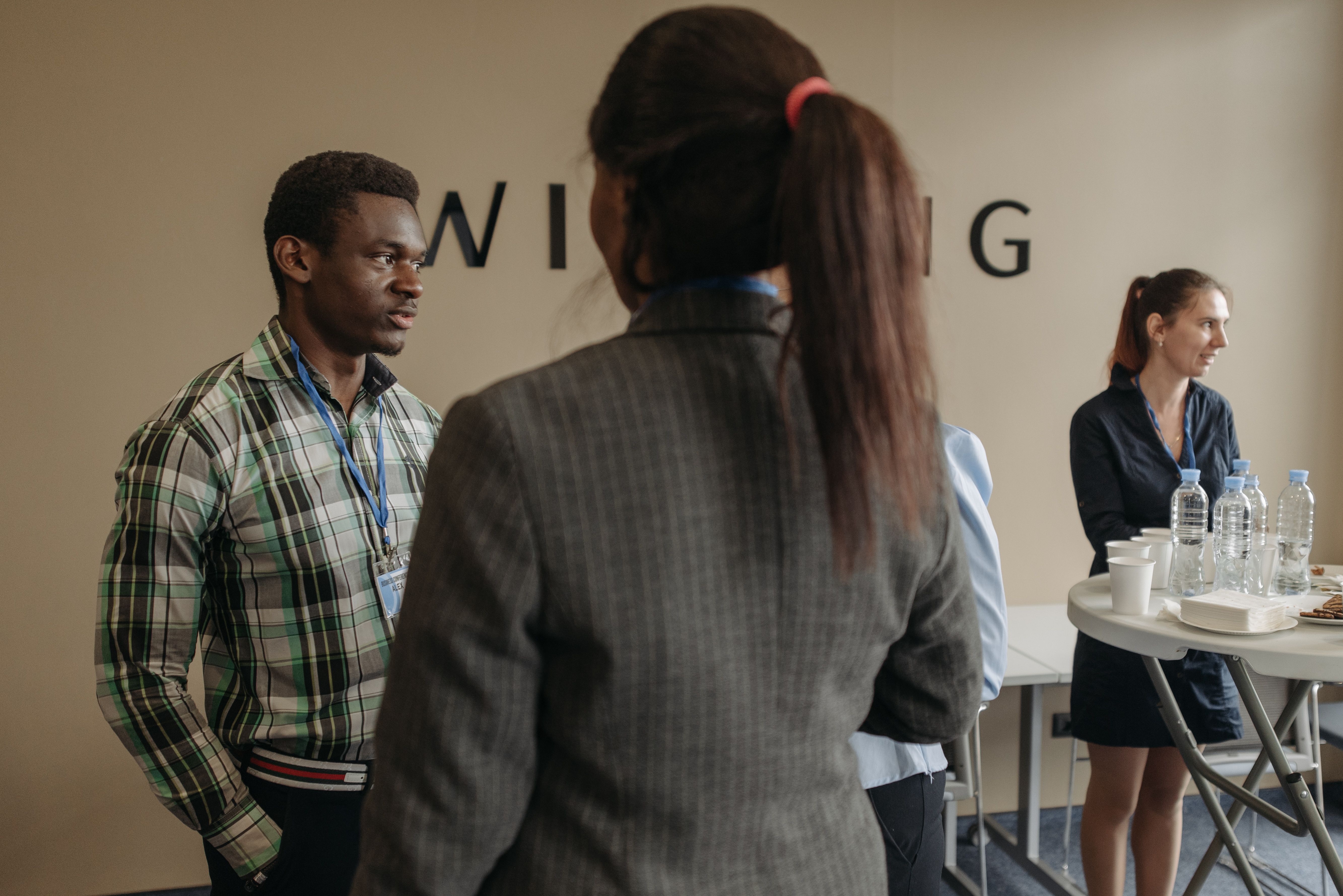 Professionals networking together in a conference room.